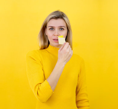 Freedom of speech concept. Blonde woman tries to speak the truth. Taped mouth