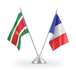 France and Suriname table flags isolated on white 3D rendering