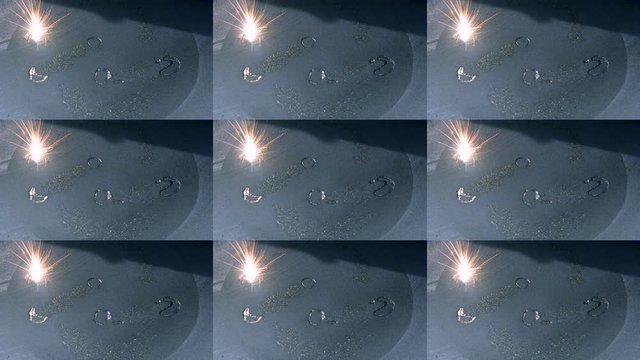 Metal is sintered under the action of laser into desired shape in chamber.