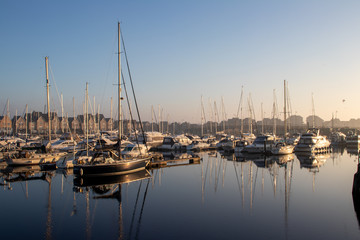 yachts moored on the marina quayside in morning
