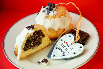 cupcake on a plate and a heart on a red background