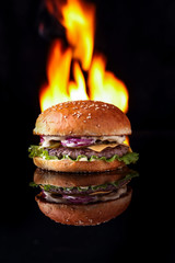  burger with fire on a black background for the site