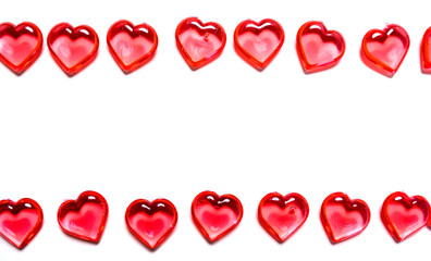 Fototapeta na wymiar A group of red hearts on a white background with copy space. Valentine's day theme.