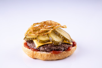  phased assembly of a hamburger on a light background7