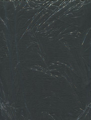 transparent thin polyethylene texture on a black background