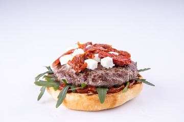  phased assembly of a hamburger on a light background3