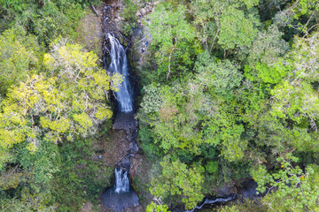 rappelling down a waterfall