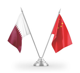 China and Qatar table flags isolated on white 3D rendering
