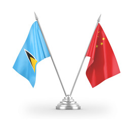 China and Saint Lucia table flags isolated on white 3D rendering