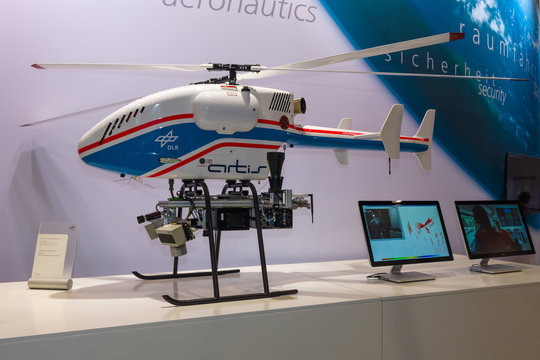 BERLIN, GERMANY - JUNE 01, 2016: The stand of German Aerospace Center (DLR). Helicopter Drone SuperARTIS (Autonomous Rotorcraft Testbed for Intelligent Systems). Exhibition ILA Berlin Air Show 2016.