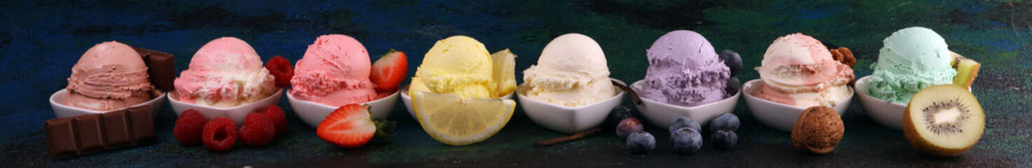 Various of ice cream flavor whit fresh blueberry, strawberry, kiwi, lemon, vanilla setup on rustic...