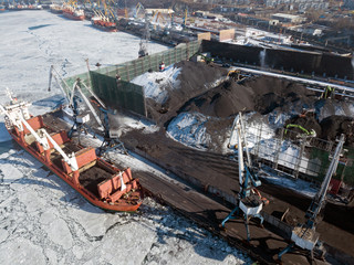 Coal loading on a vessel in port
