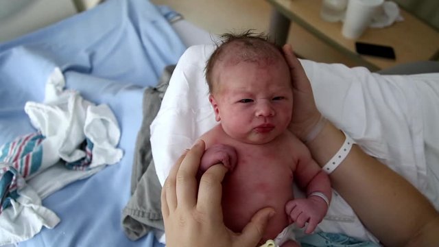 Newborn baby in the paediatrics ward of a hospital