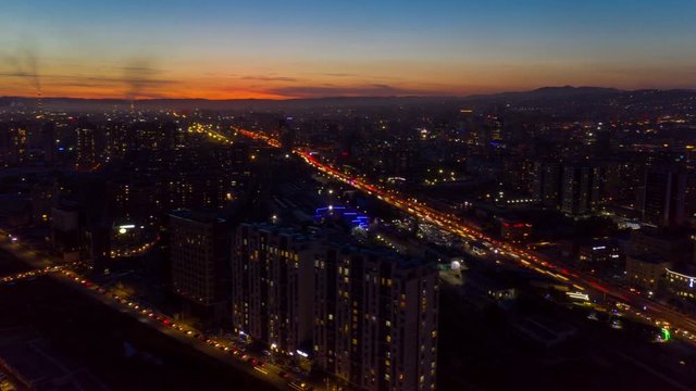 Aerial Mongolia Time Lapse 12056-61 Ulaanbaatar Downtown Sunset September 2019 4K  Aerial time lapse video of downtown central Ulaanbaatar in Mongolia during a beautiful evening sunset.