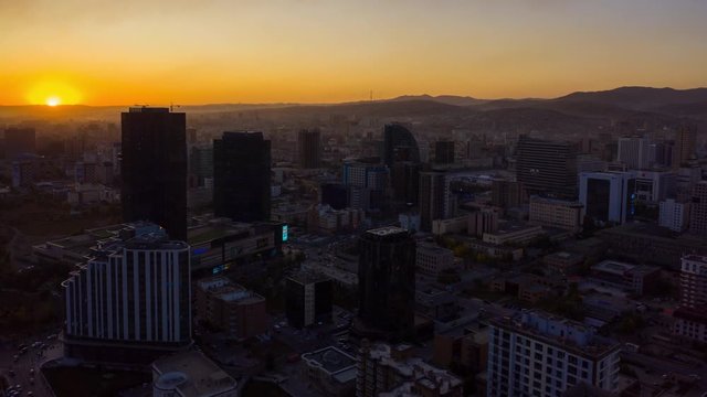Aerial Mongolia Time Lapse 12056-61 Ulaanbaatar Downtown Sunset September 2019 4K  Aerial time lapse video of downtown central Ulaanbaatar in Mongolia during a beautiful evening sunset.