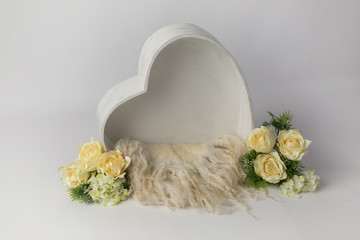 heart made of wood, decorated with roses. basket for a newborn photo shoot. white rose. heart