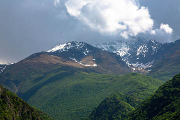 Overcast in mountains. Beautiful mountain rocks in clouds. Landscape of the North Caucasus