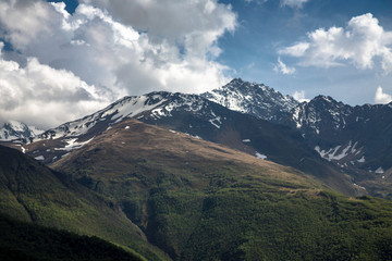 Overcast in mountains. Beautiful mountain rocks in clouds. Landscape of the North Caucasus