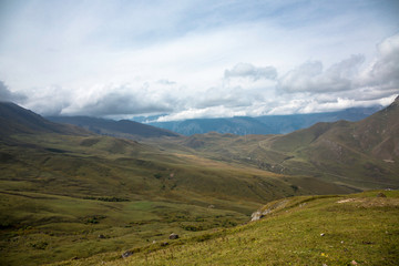 Obraz premium Overcast in mountains. Beautiful mountain rocks in clouds. Landscape of the North Caucasus