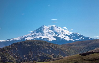 Fototapeta premium Mount Elbrus. View of snow tops of high Mount Elbrus. Landscape of the North Caucasus