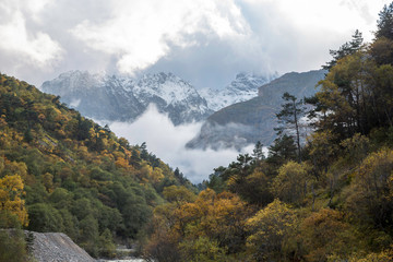 Overcast in mountains. Beautiful mountain rocks in clouds. Landscape of the North Caucasus