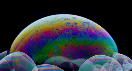 Curve of rainbow colors created by soap,wall art, colors mix signer from oil makes can use background,Fancy Dream Cloud of oil mixed.