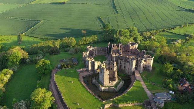 4K aerial dawn footage of Raglan castle, a late medieval castle located in the county of Monmouthshire in South Wales.