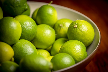 fresh green limes in a bowl