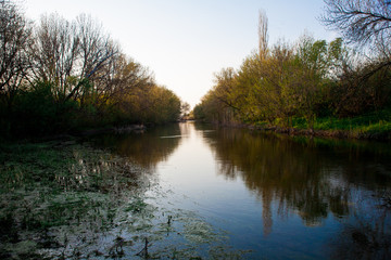 Dawn sky with dark clouds illuminated by the sun.