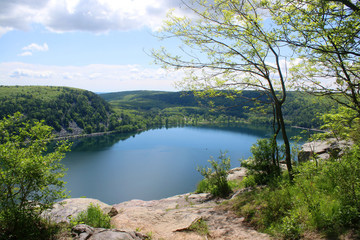 Beautiful Wisconsin late spring nature background. Areal view on the lake from West Bluff rocky ice age hiking trail. Devil's Lake State Park, Baraboo area, Wisconsin, Midwest USA.