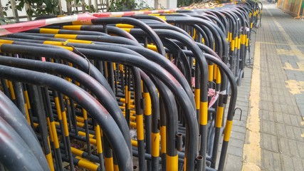 The iron horse guardrail is on the sidewalk