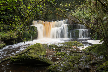 Fototapeta premium The Chute running high below McLean Falls in the Catlins, Otago, New Zealand. Long exposure.