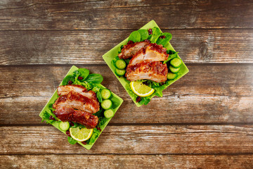 Pork chop baked with BBQ sauce , cucumber and spinach.