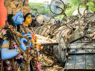 Discarded Hindu statues and rickshaws,Kolkata,West Bengal,India.