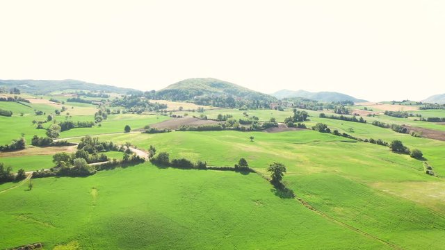 aerial view over a green landscape and a country road next to Bardone (Terenzo), Province of Parma, Emilia-Romagna, Italy