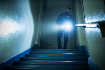 Security Guard With Flashlight