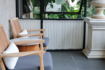 Fototapeta premium pillow cushion on wooden chair in hotel resort in living room