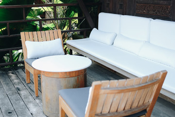 wooden chair and sofa couch for relaxing on terrace balcony