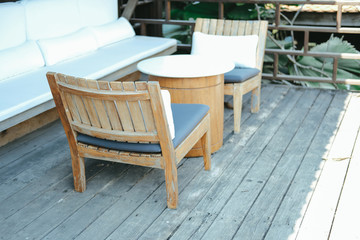 wooden chair and sofa couch for relaxing on terrace balcony