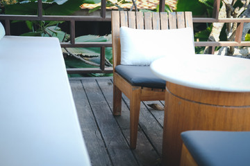 wooden chair and sofa couch for relaxing on terrace balcony