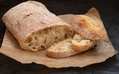 Fresh ciabatta bread on parchment paper