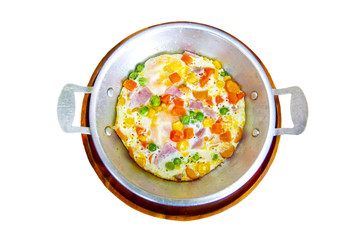 Fried eggs pan cooked from egg and corn carrots bacon ham and lantau nuts are a popular breakfast menu in Thailand Restaurant with colors White background