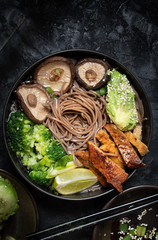 Vegan soba noodles bowl with shiitake, avocado, broccoli, seitan