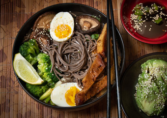 Vegetarian soba noodles bowl with shiitake, avocado, broccoli, egg, seitan