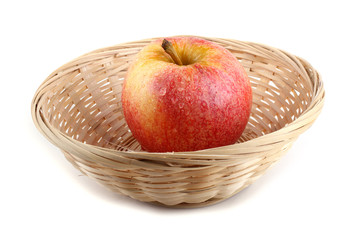 Apple on wicked plate