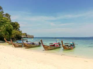 Fototapeta na wymiar Longtail boat parked to wait for tourists at Ao Nang beach, Thailand.