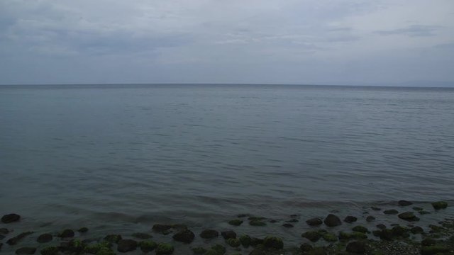A vast expanse of the sea in a cloudy day