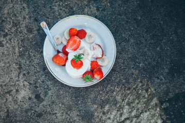 ice cream dessert with fruit close-up. Advertising concept of desserts, sweets, cooking, holidays