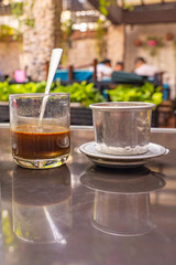 Vietnamese brewed coffee with dripping filter- Ca Phe Sua