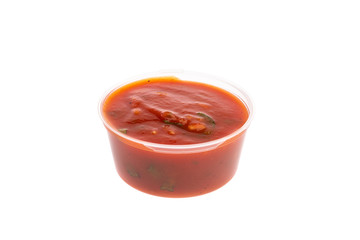 spicy meat seasonings ketchup, adjika, sauce in transparent plastic containers isolated